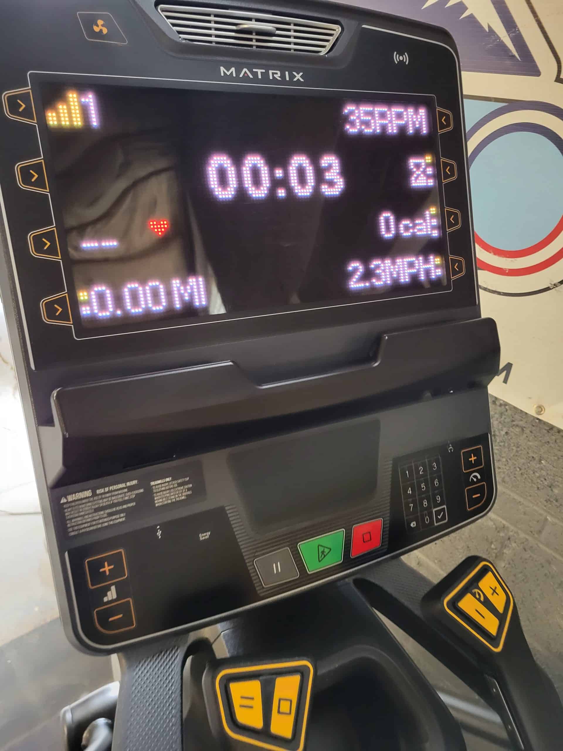 High-tech treadmill display at Colorado Cardio clinic, showcasing heart rate, speed, and workout duration, emphasizing advanced cardiac and fitness assessment services.