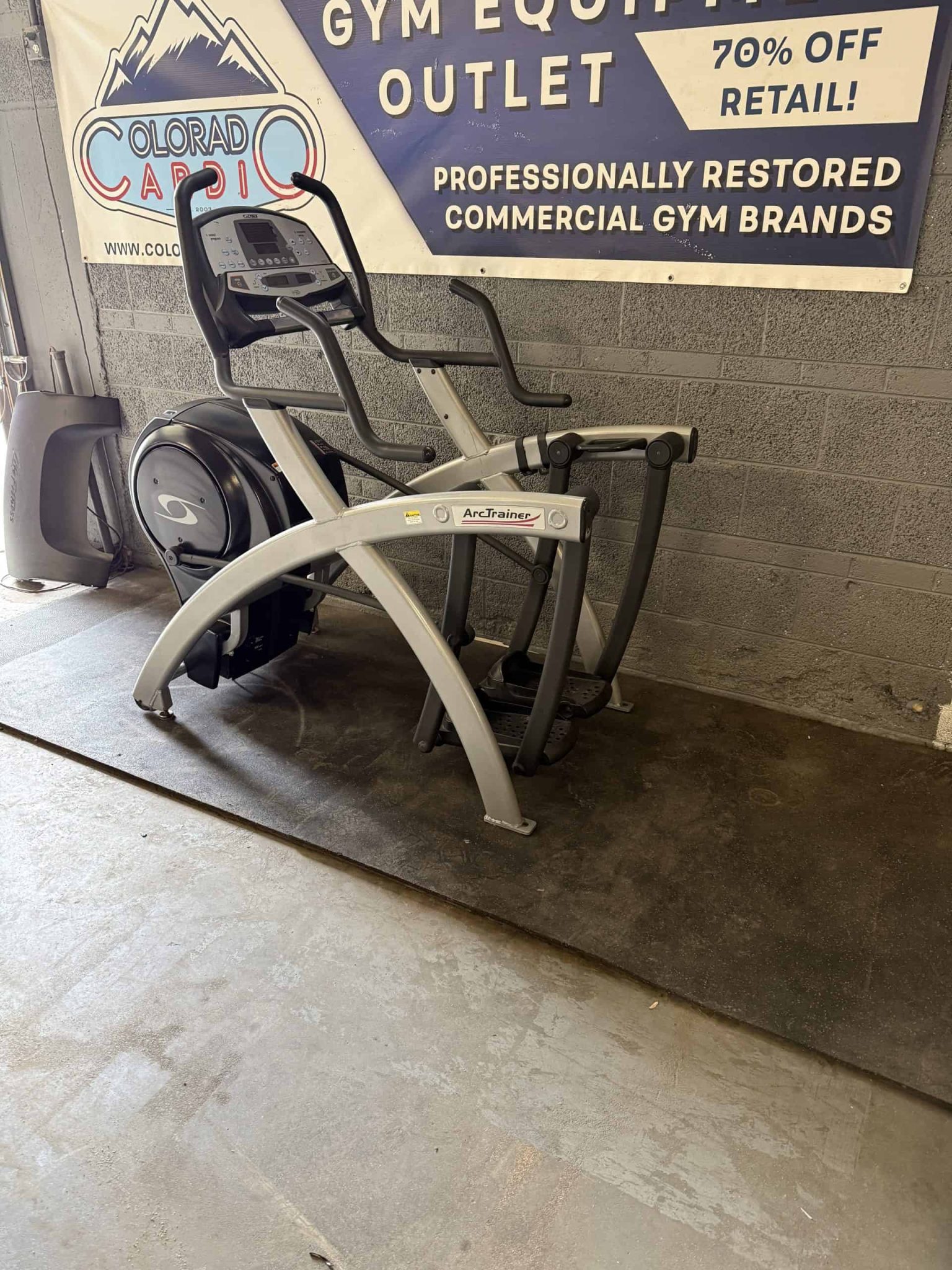 Indoor commercial elliptical trainer at Colorado Cardio, a trusted gym equipment outlet specializing in professionally restored gym brands and offering discounts.