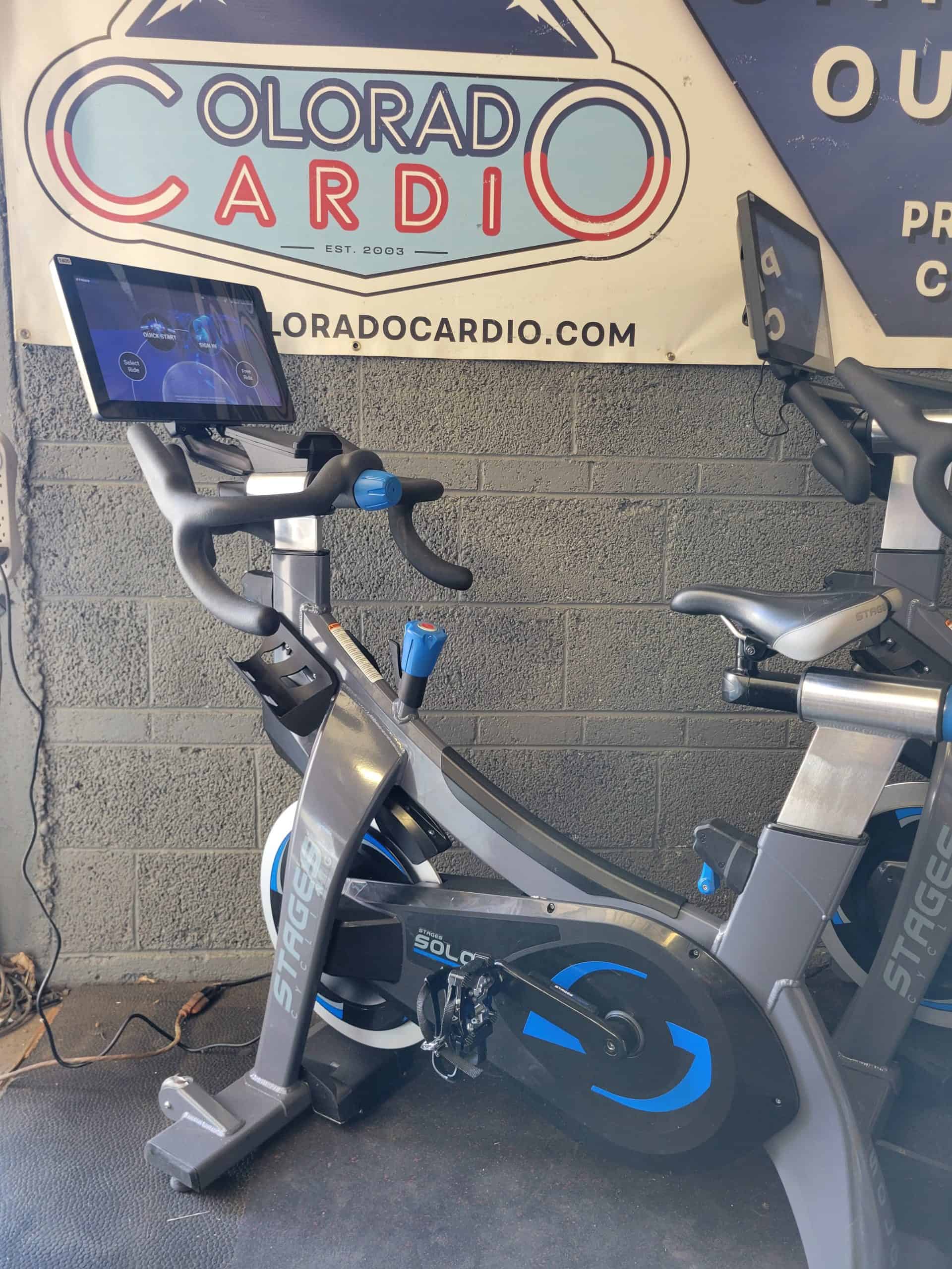 Enhanced fitness cycle machine with digital screen at Colorado Cardio for cardiac health and exercise.