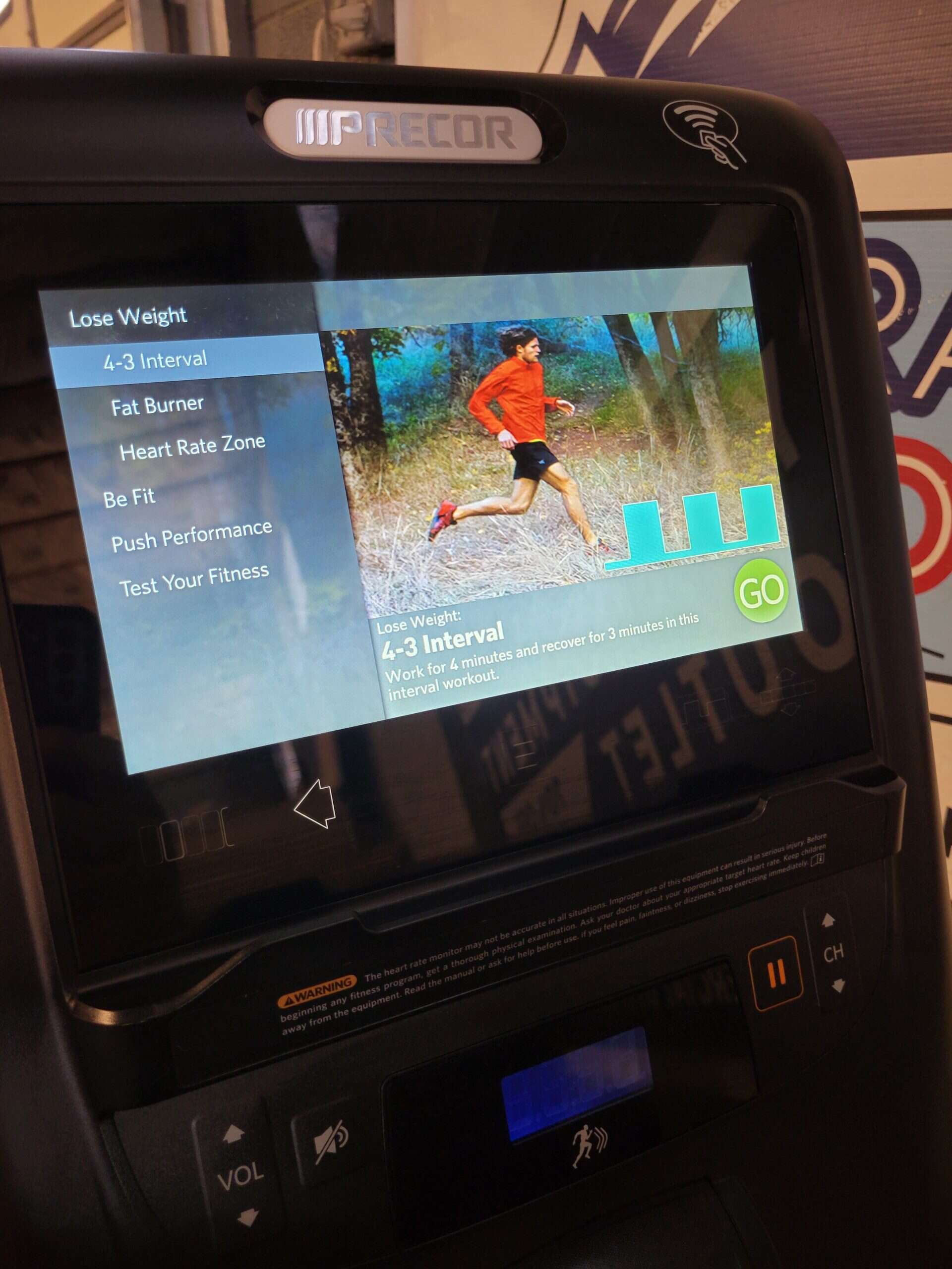 High-tech treadmill with touchscreen displaying heart health and fitness program options at Colorado Cardio, specializing in cardiovascular testing and fitness solutions.